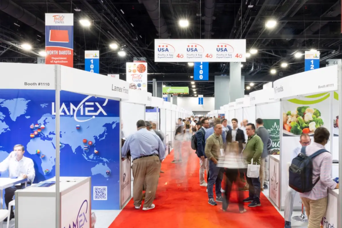 An image of an expo with people attending different booths